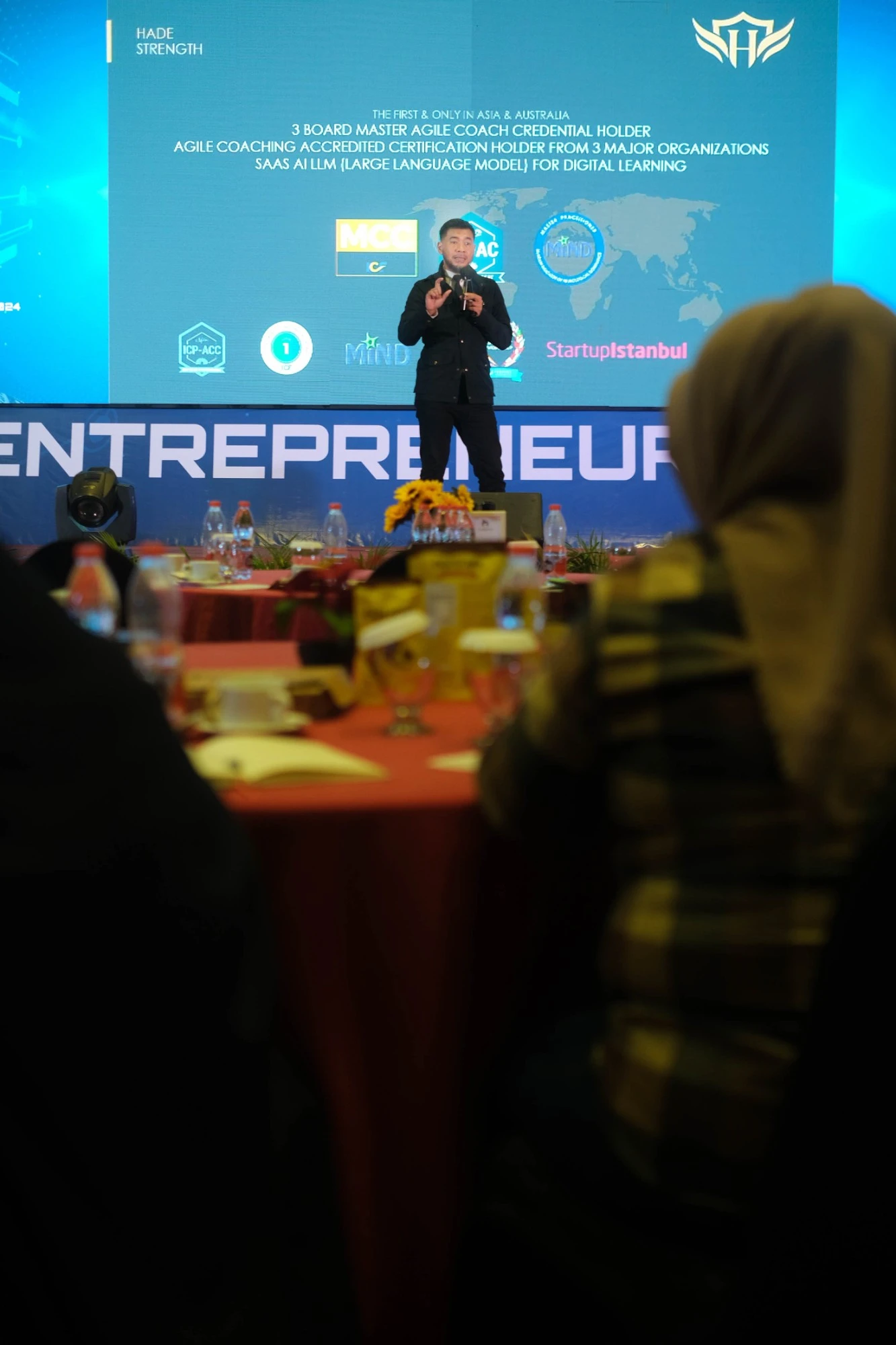 Coach Daru presenting at an entrepreneur summit