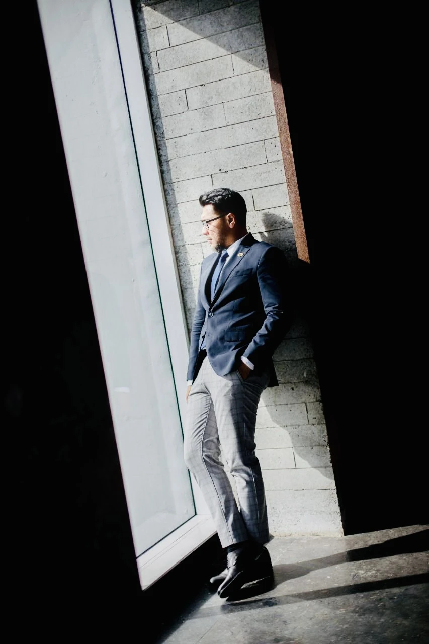 Coach Daru Dewayanto standing by a window
