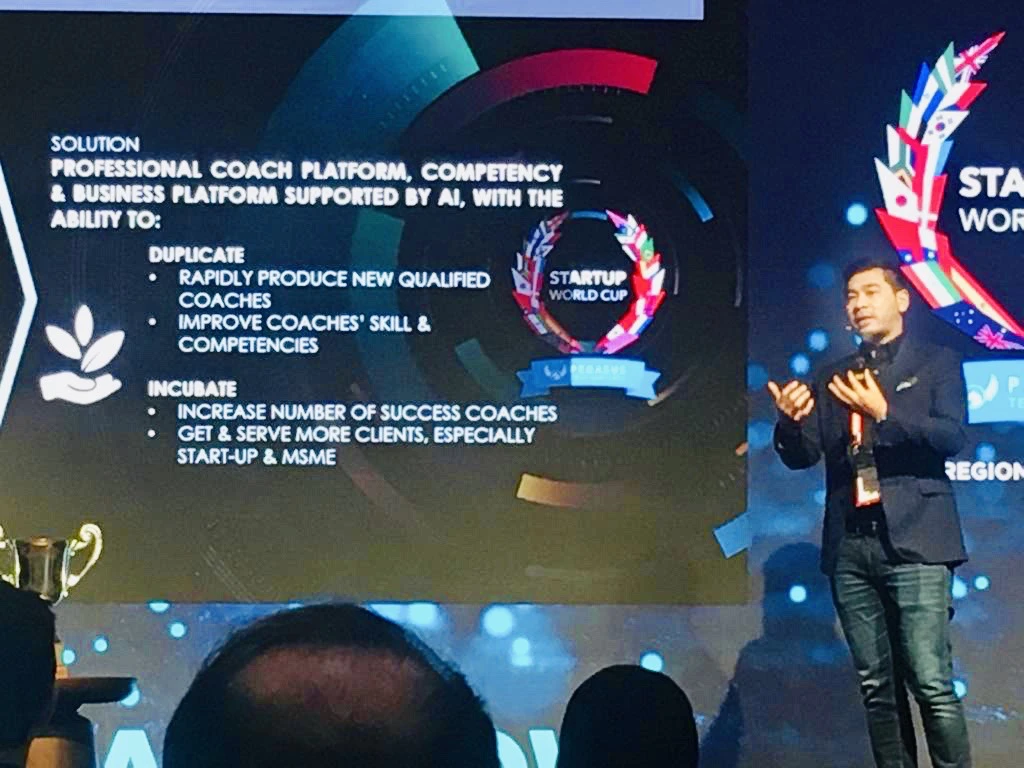 Coach Daru on stage at the Startup World Cup